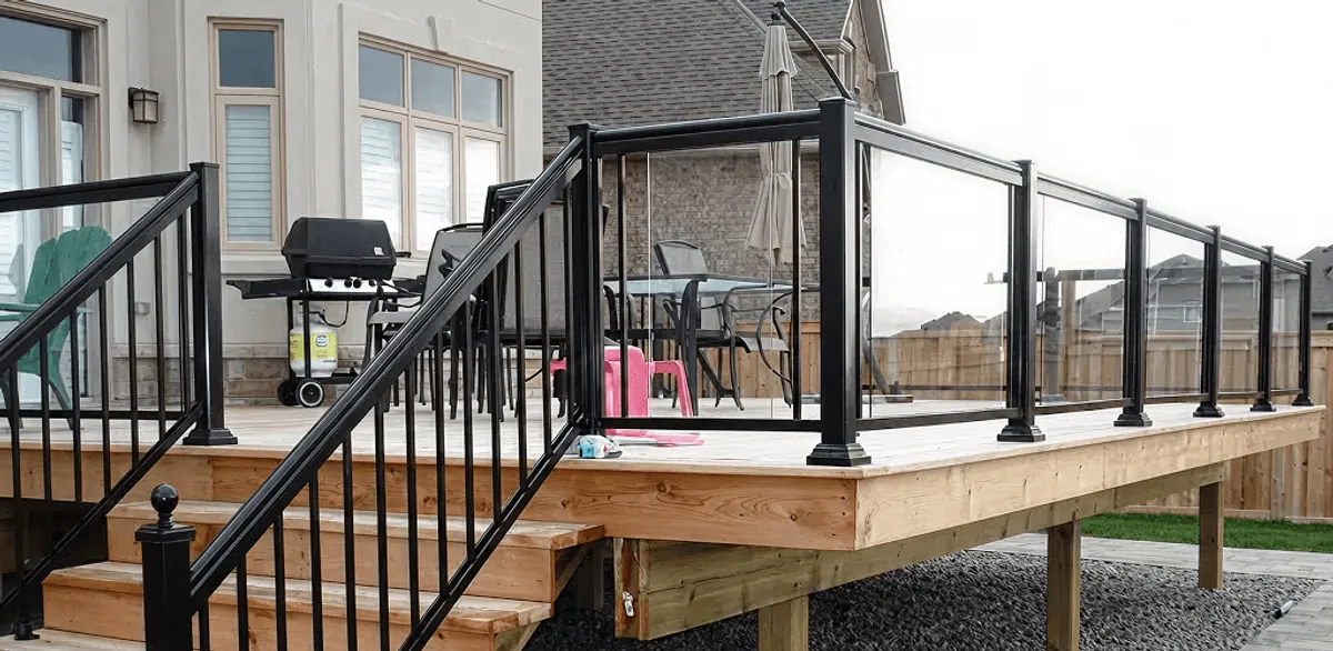 Handrail installation on a deck staircase for safety and code compliance in Raleigh, NC